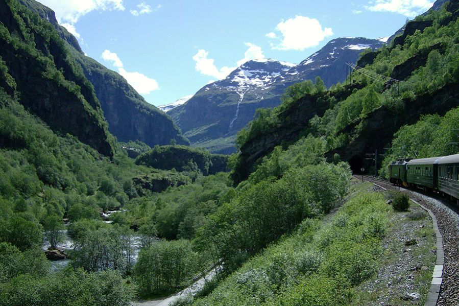 The scenic railway route from Oslo to Bergen in the lush, mountainous landscape of the summer.